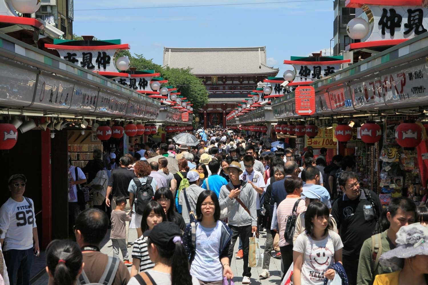 Nakamise shopping street crowded with visitors between rows of souvenir stalls