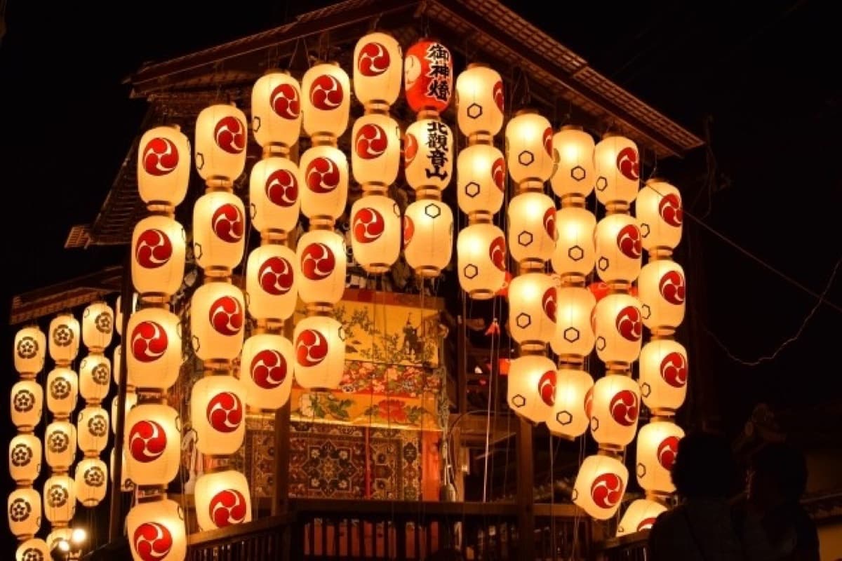 A Kyoto summer festival evening along the river, the kind of atmosphere on Okuribi night
