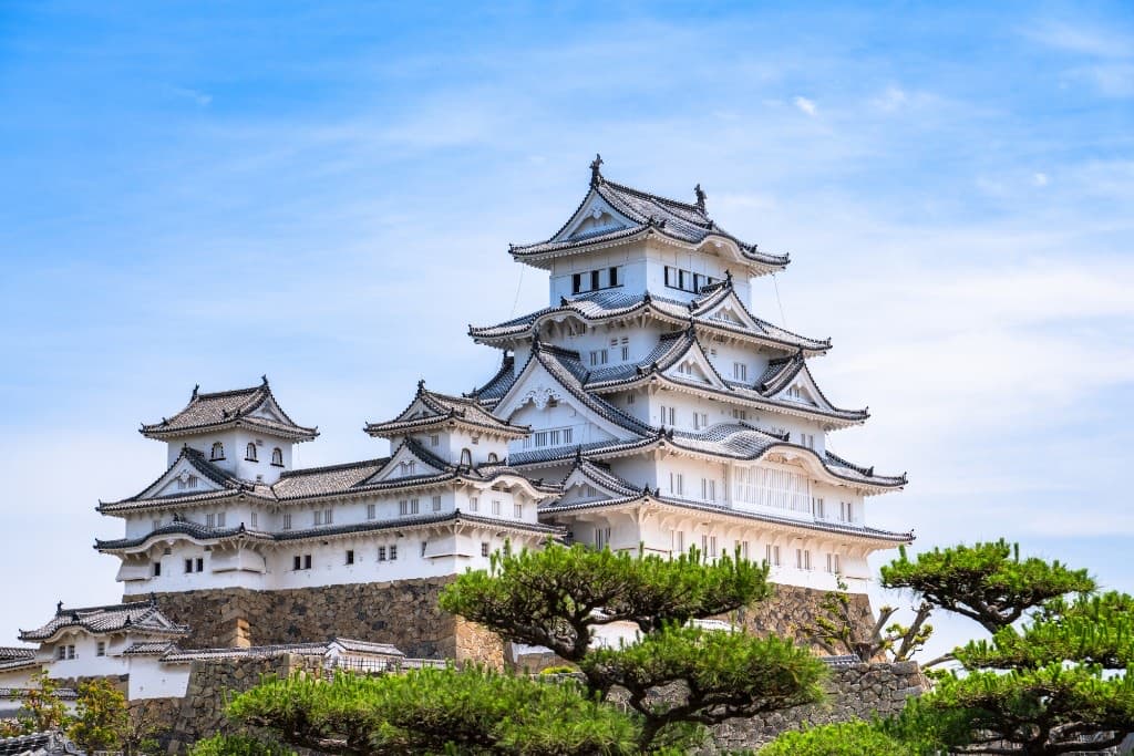 Himeji Castle, the brilliant white keep of a UNESCO World Heritage castle, under a clear blue sky