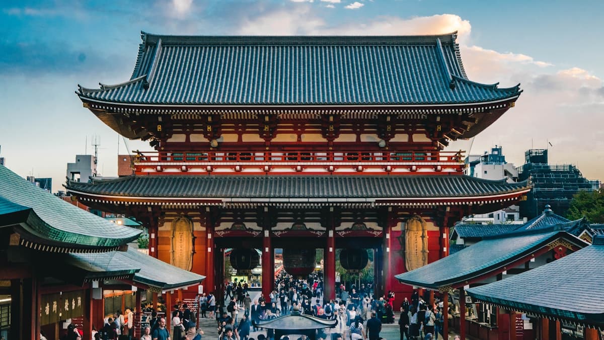 The red gate hall of Senso-ji temple in Asakusa with crowds in the courtyard
