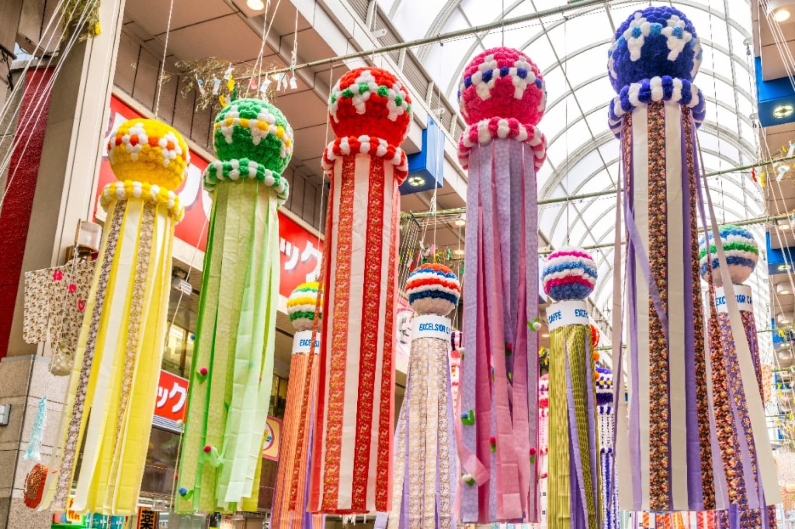 Colorful Sendai Tanabata streamers hanging in a covered shopping arcade
