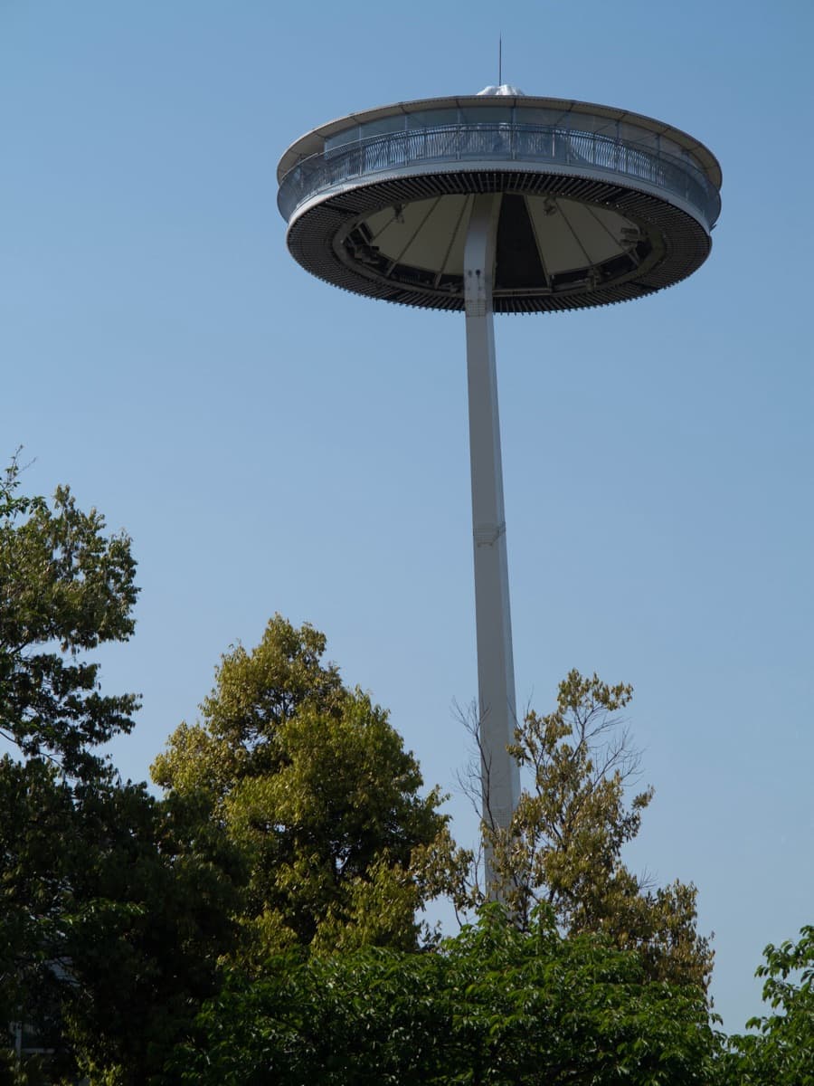 The Island Fuji observation tower, a round viewing deck on a tall white column above the trees