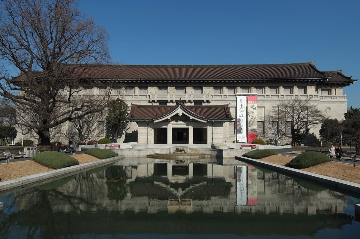 The Tokyo National Museum main building behind a long reflecting pond